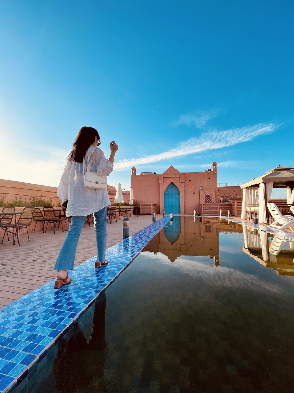 woman, morocco, fashion Top destinations: Cities such as Marrakesh, Fez, Casablanca, and Tangier are frequently researched for their historical sites, vibrant markets, and unique architecture. Cultural experiences: Travelers seek information on traditional Moroccan cuisine, festivals, and local customs to enrich their visit. Travel logistics: Queries about visa requirements, best times to visit, transportation options, and accommodation are common among prospective visitors. Adventure activities: Many search for opportunities like Sahara Desert excursions, trekking in the Atlas Mountains, and coastal experiences in cities like Essaouira. Safety and travel advisories: Travelers often look for the latest information on safety, health precautions, and travel advisories to ensure a secure trip.