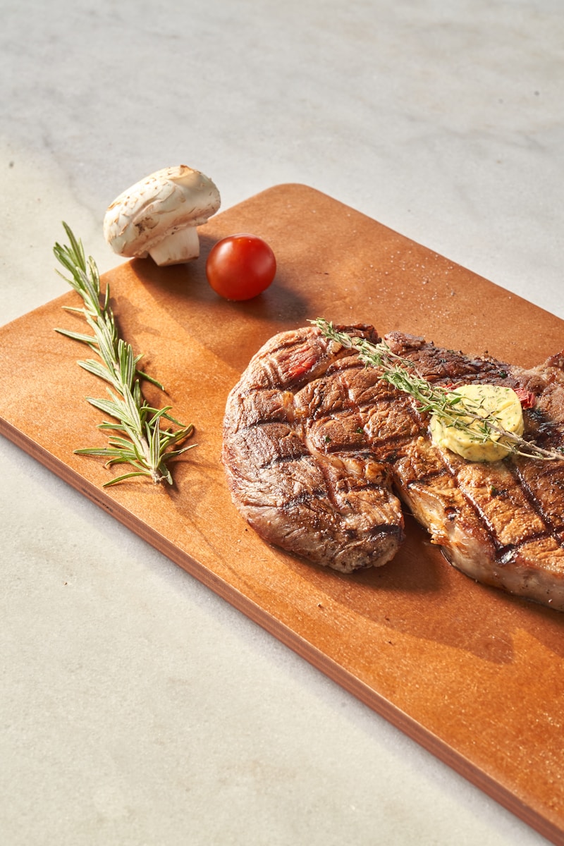 Beef Chicken Pork Steak Bacon Ground beef Chicken breast Pork chops Beef stew Chicken wings BBQ ribs Grilled chicken Pulled pork Beef brisket Chicken thighs Pork tenderloin Beef burgers Chicken nuggets Pork belly Meatloaf sliced bread with sliced tomato and meat on brown wooden chopping board